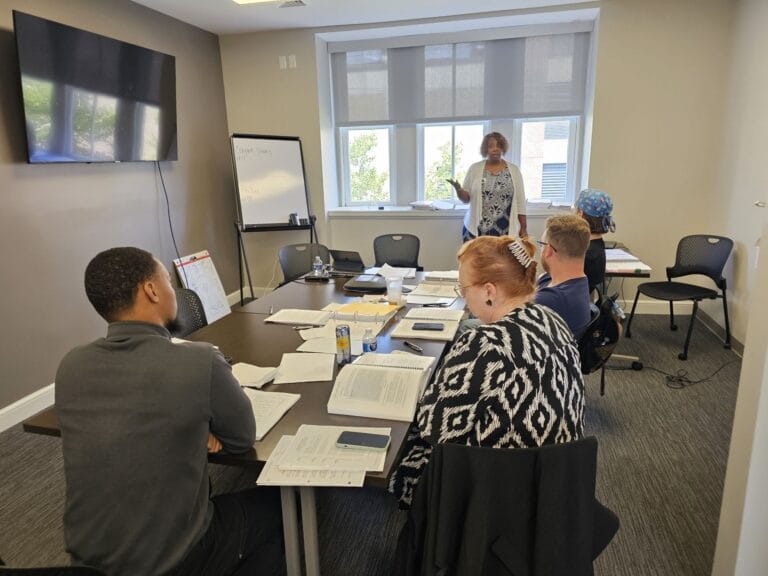 Instructor leading an in-person Impact Training class